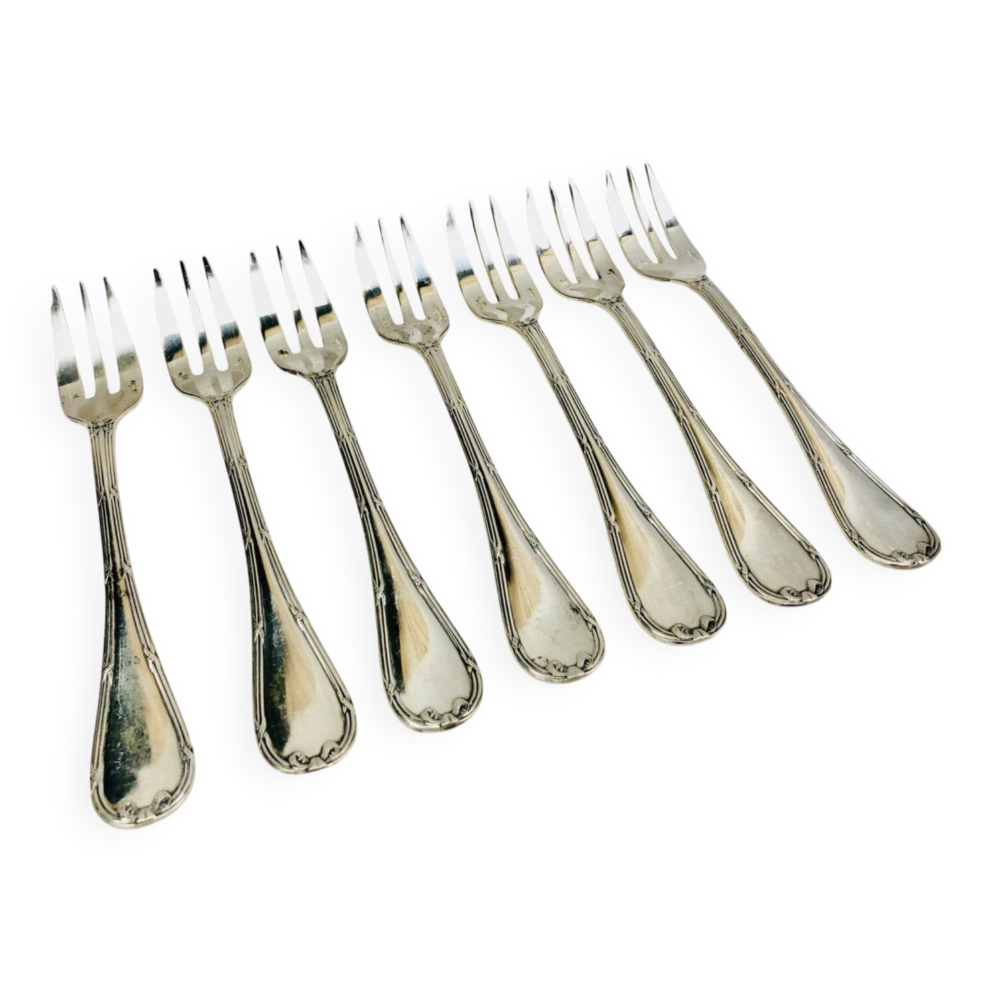 7 Christofle silver-plated oyster forks with Louis crossed ribbons