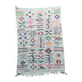 White Moroccan rug with Berber patterns.