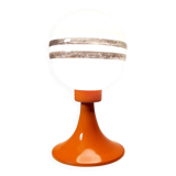 Orange metal and glass table lamp, circa 1960.