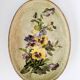 Oval metal decorative vintage tray with floral pattern.