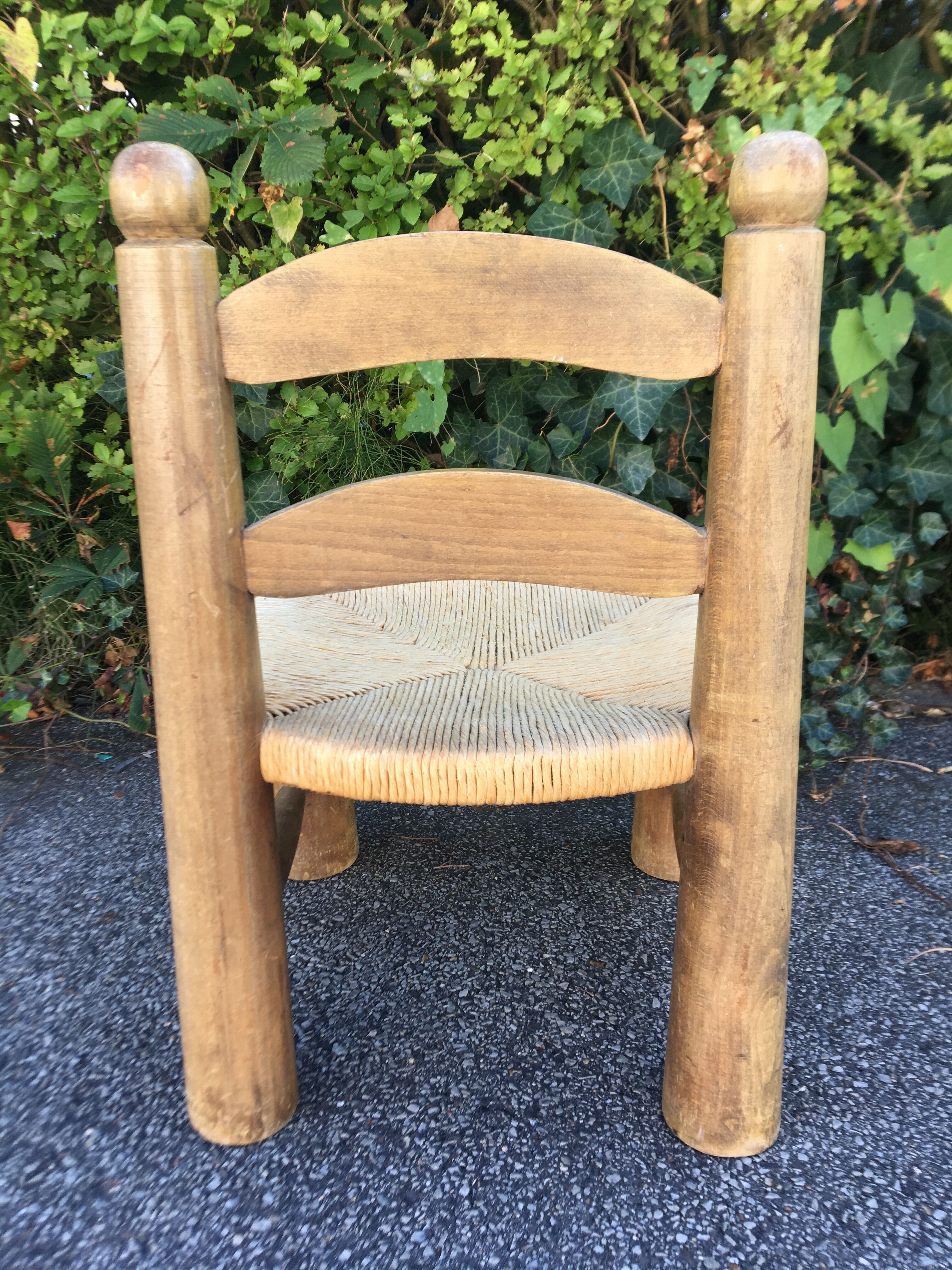 Low wooden chair and straw 50s