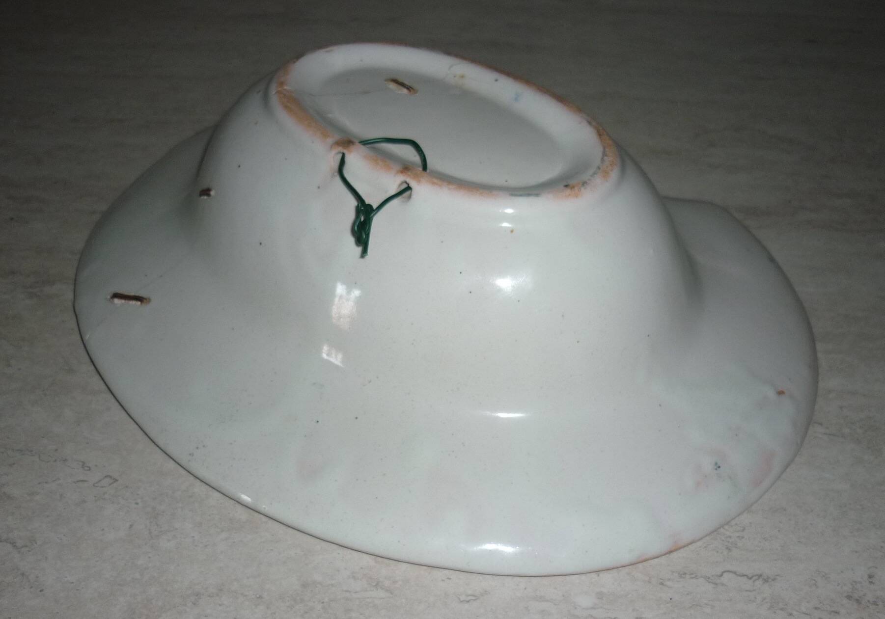 Old beard dish repair with staples