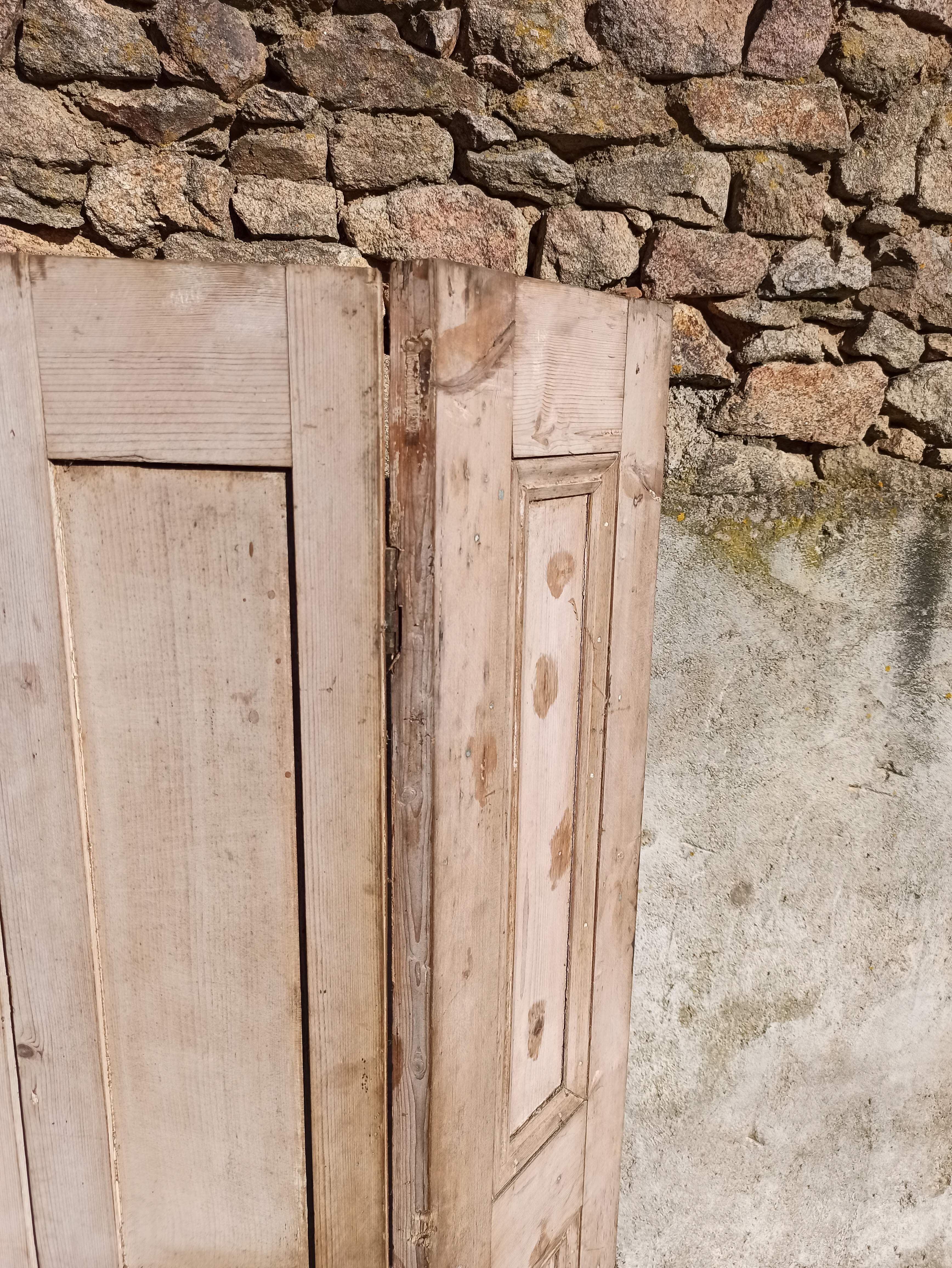 Old trio of wooden screen doors