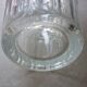 Transparent glass vase with art deco geometric patterns