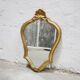 Miroir vintage de style baroque en bois doré