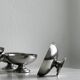 5 silver metal cups.