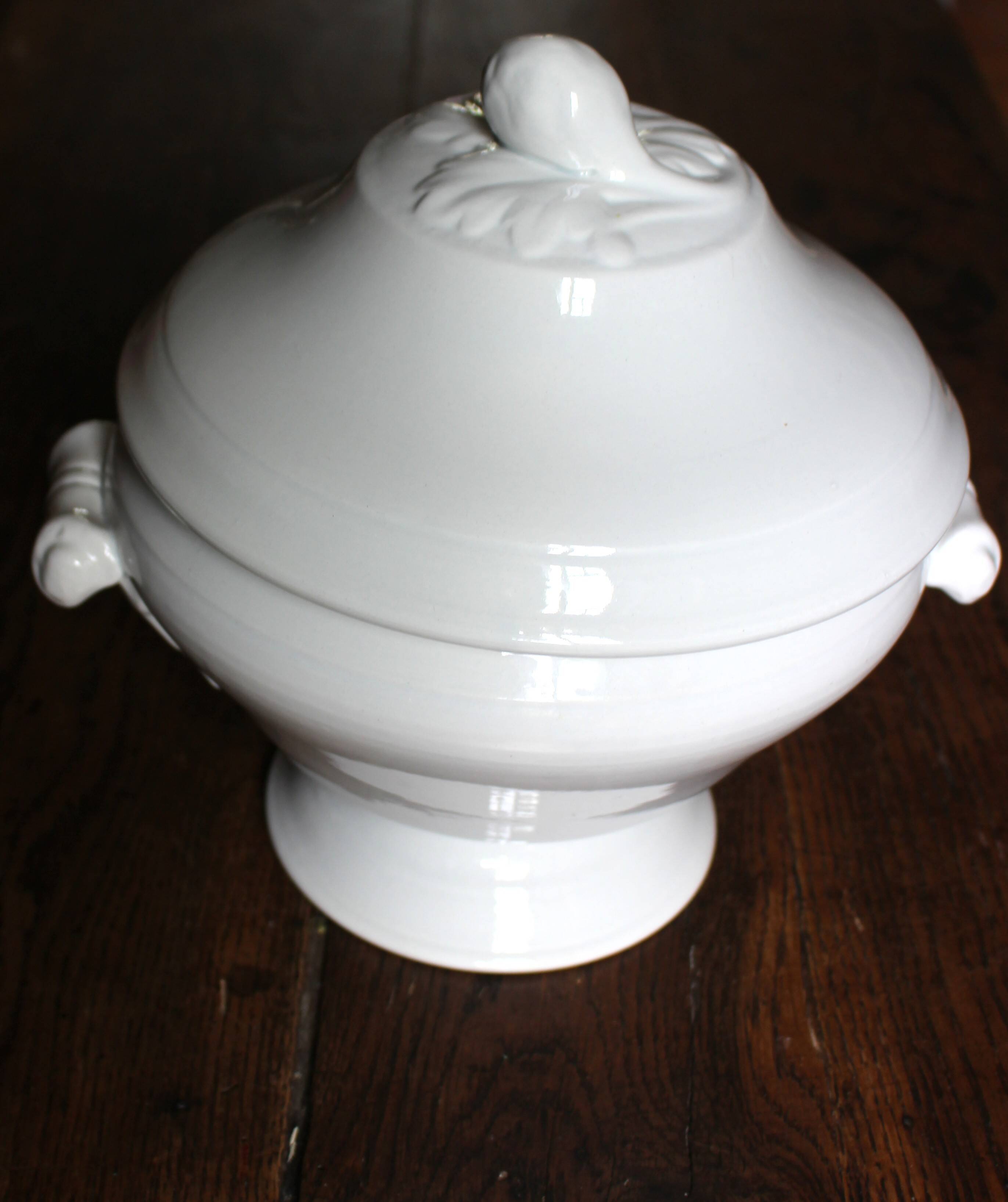 Antique soup tureen, white earthenware, with stopper decoration.