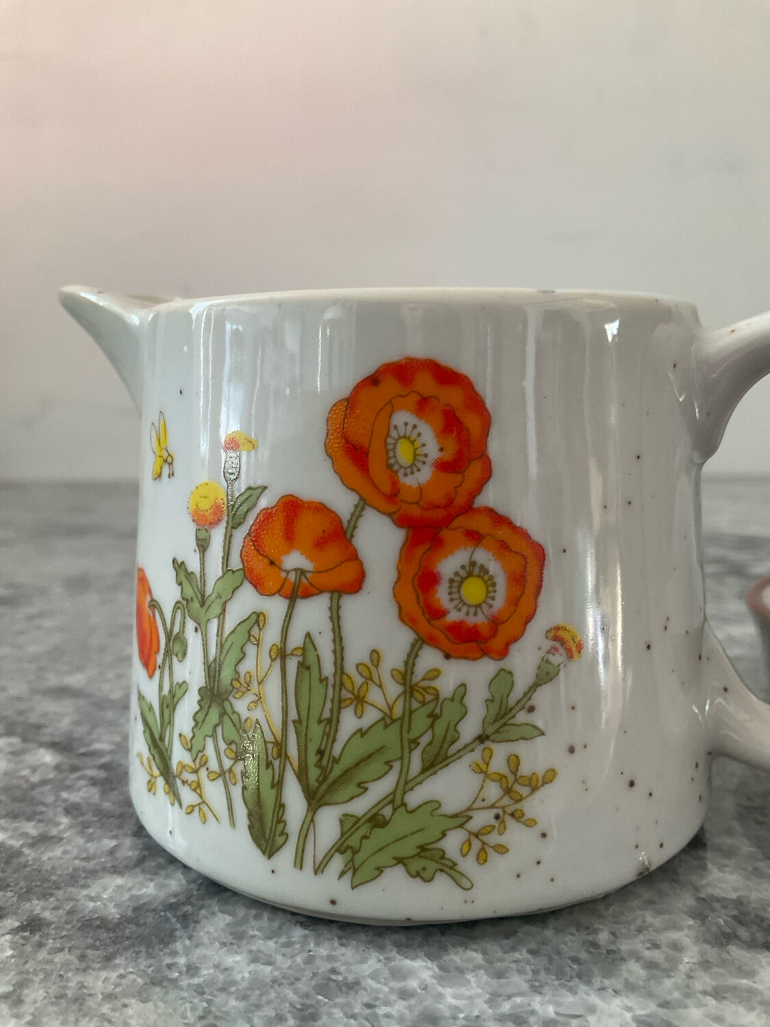 Vintage stoneware jug and its citrus juicer.