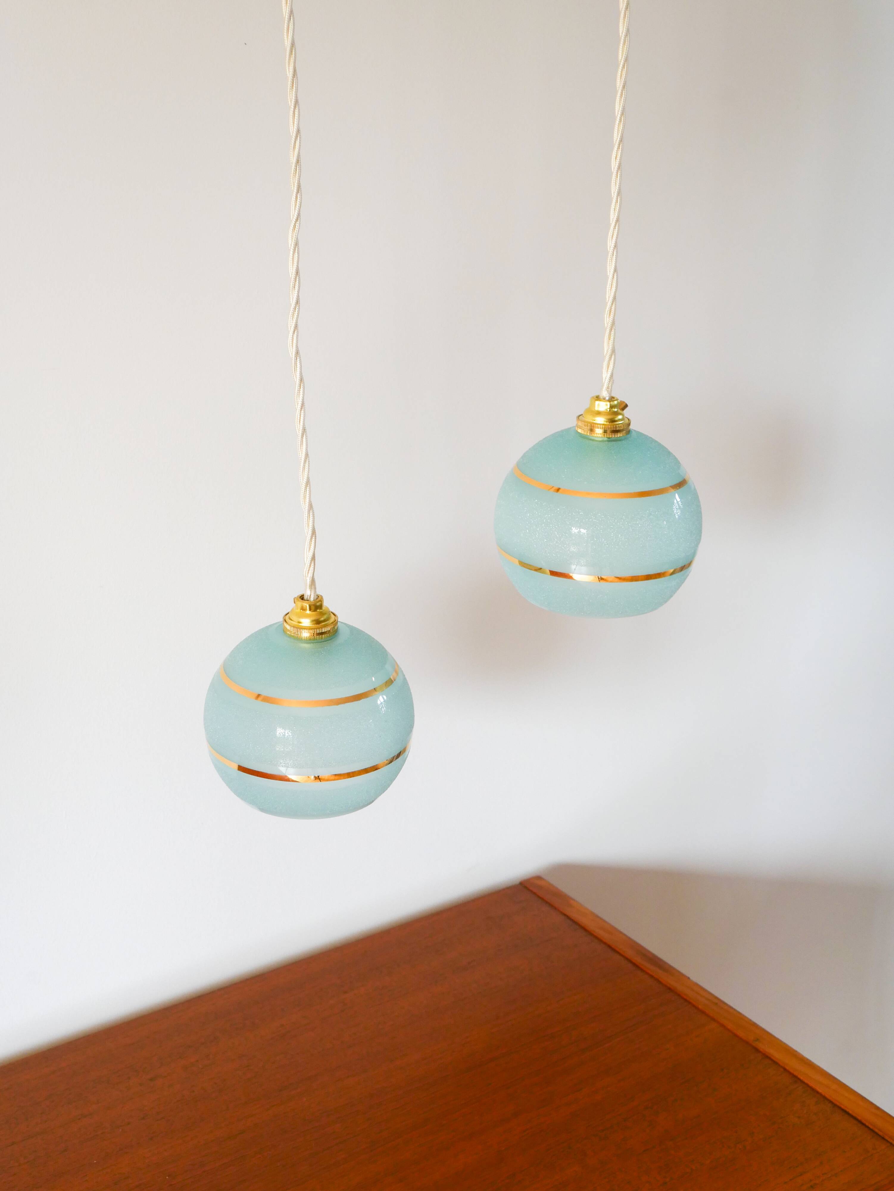 pair of blue and gold granite ball pendants 1950