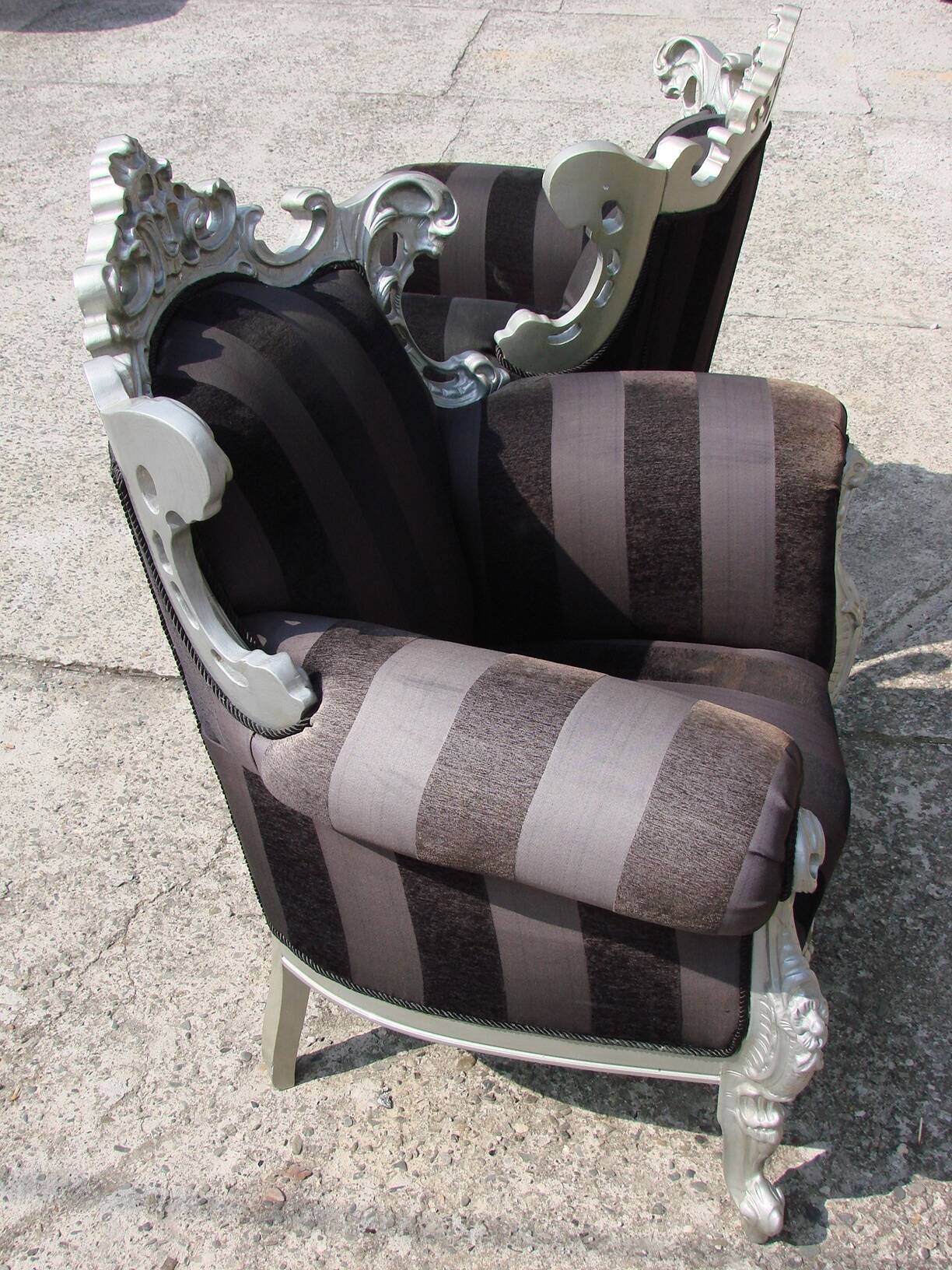 A pair of vintage armchairs, 1980s, lacquered wood and fabric