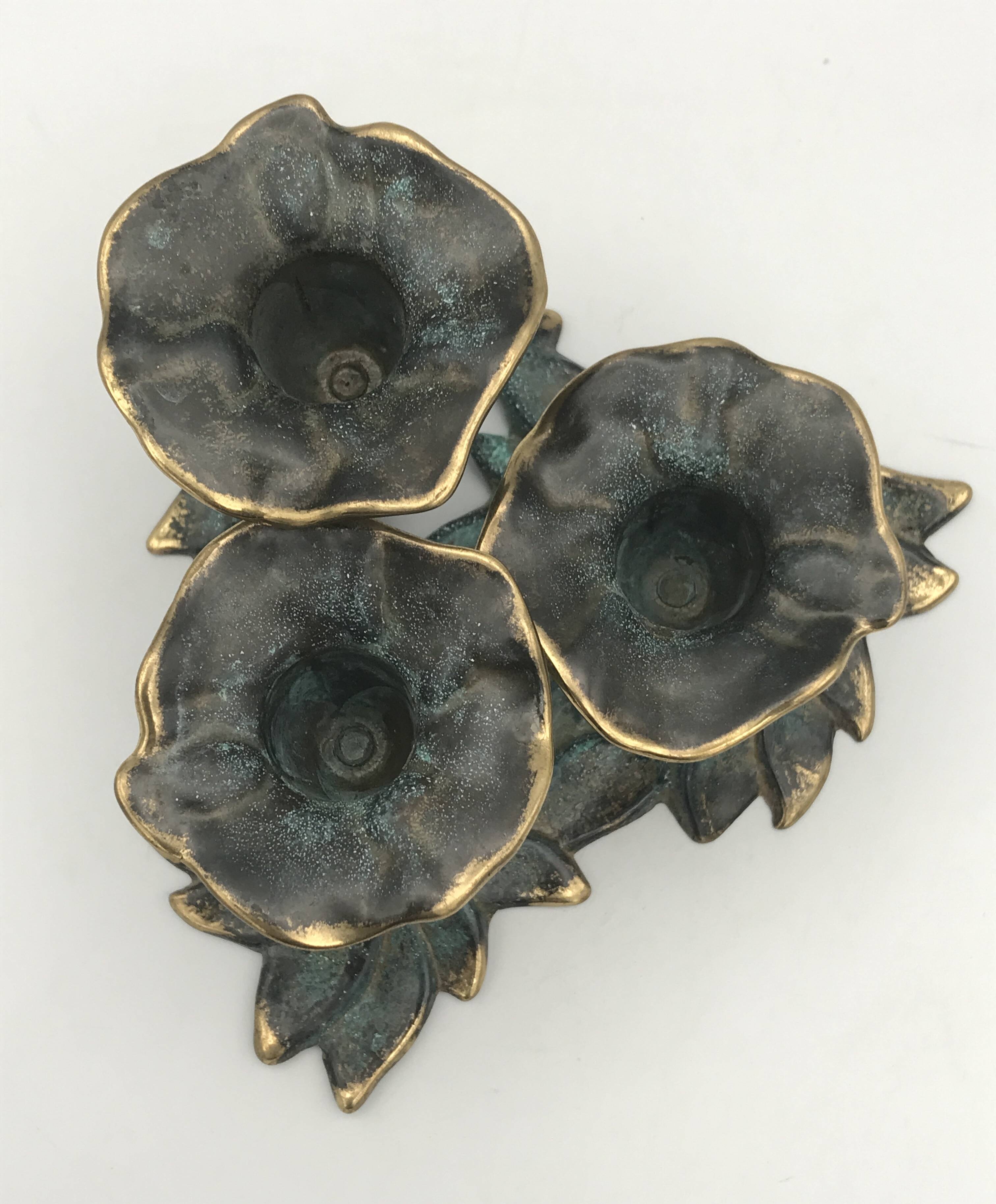 3-flower brass candlestick with green patina
