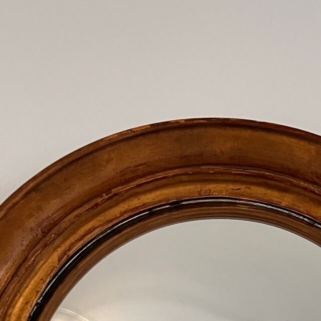 Witch's mirror with wood frame and curved ice