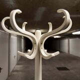 Parrot wears white Baumann coat 1970