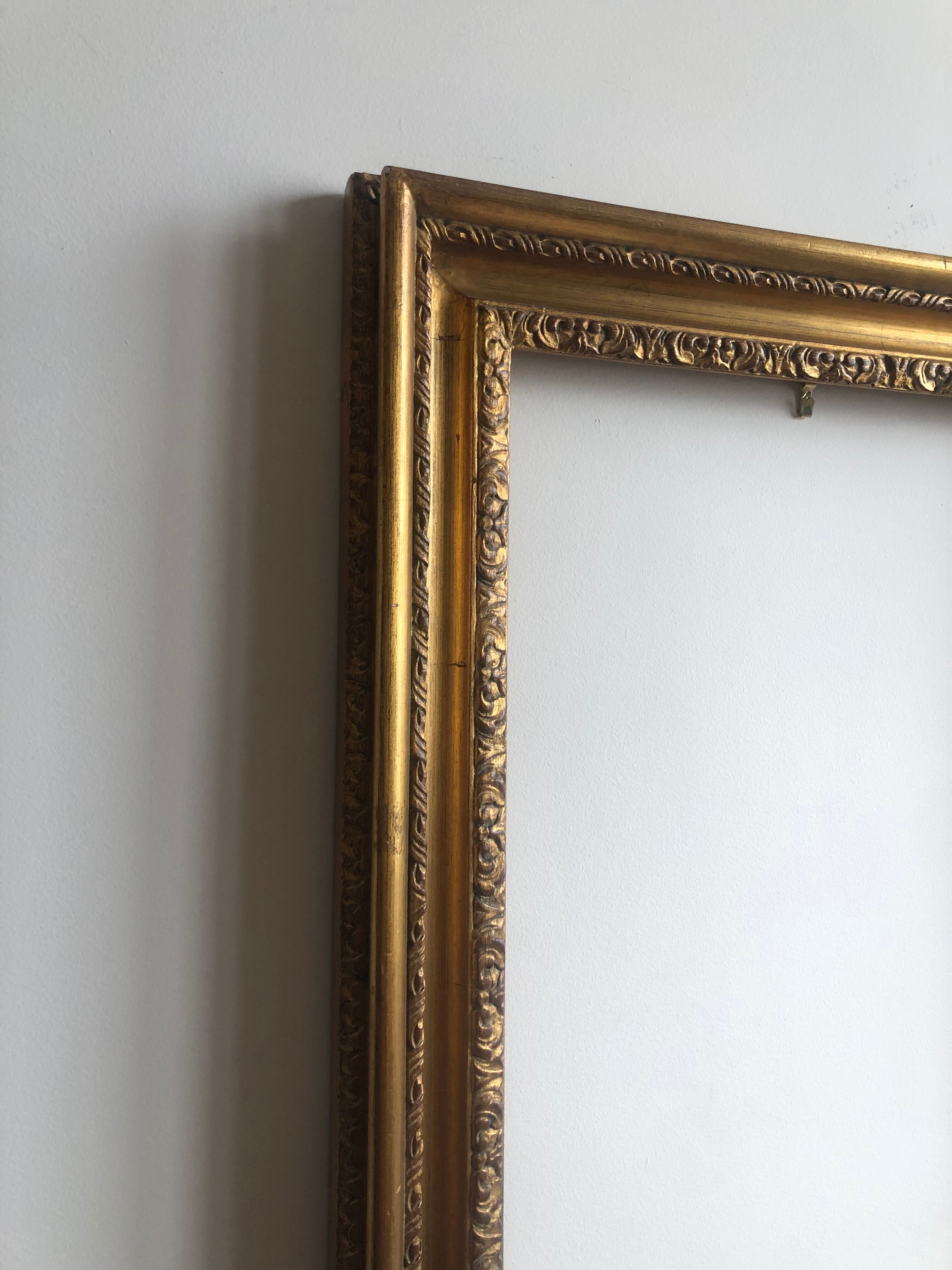 Wooden frame and gilded stucco
