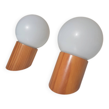 Pair of vintage wall lights in varnished pine and opal glass, 1970s-80s.