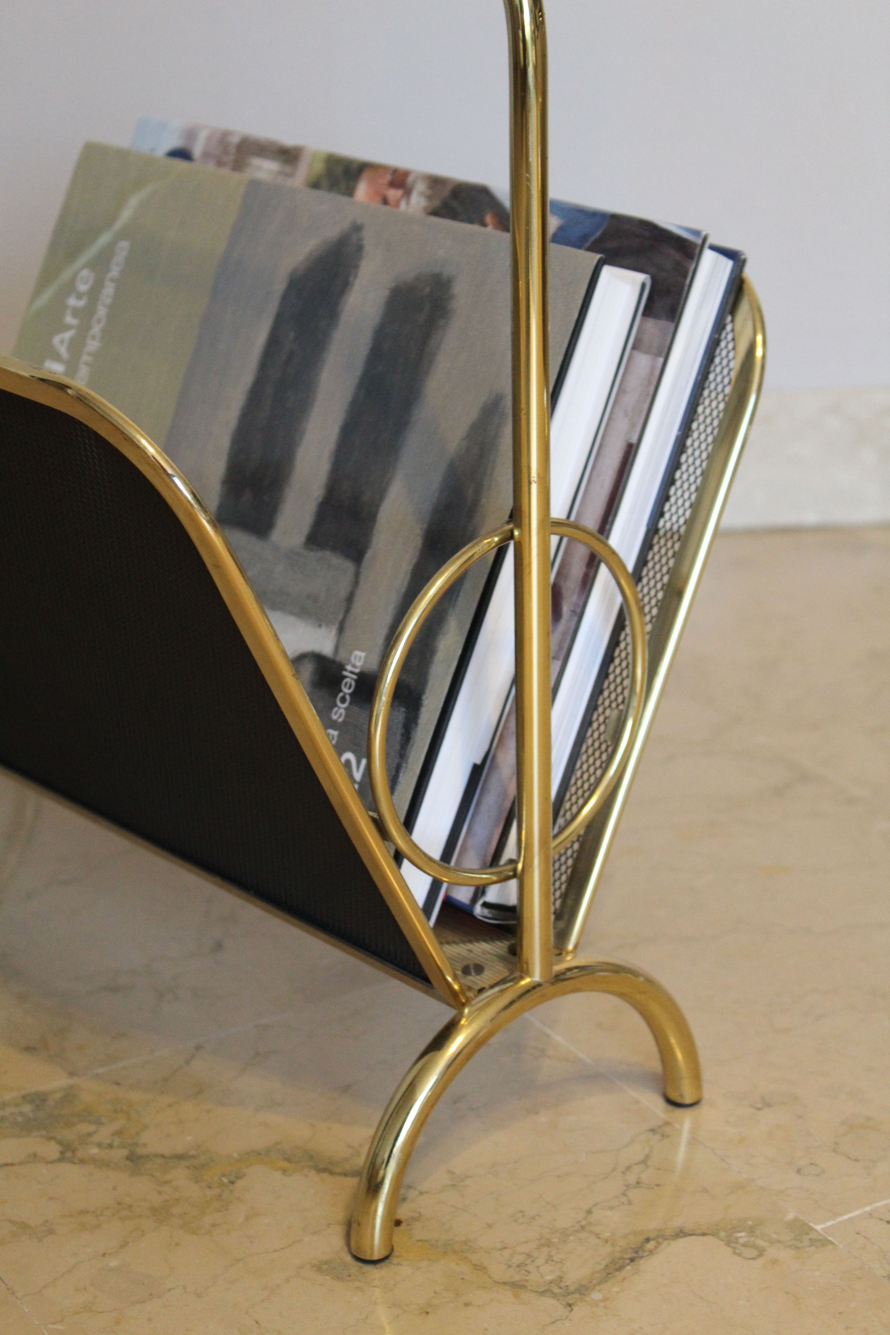 Magazine rack in brass and black lacquered metal, Italy 1970s