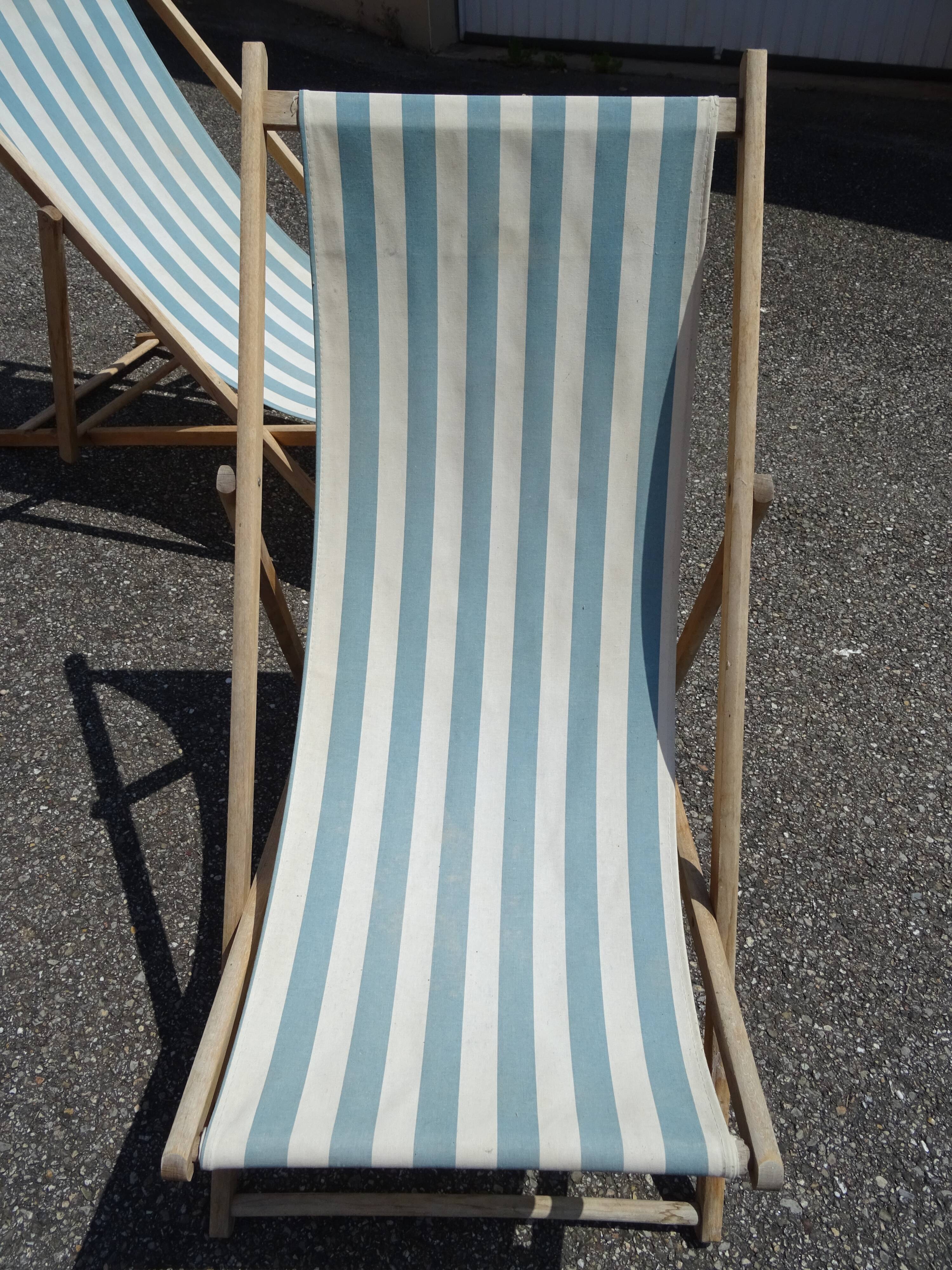 Pair of sun loungers with vintage blue blue stripes