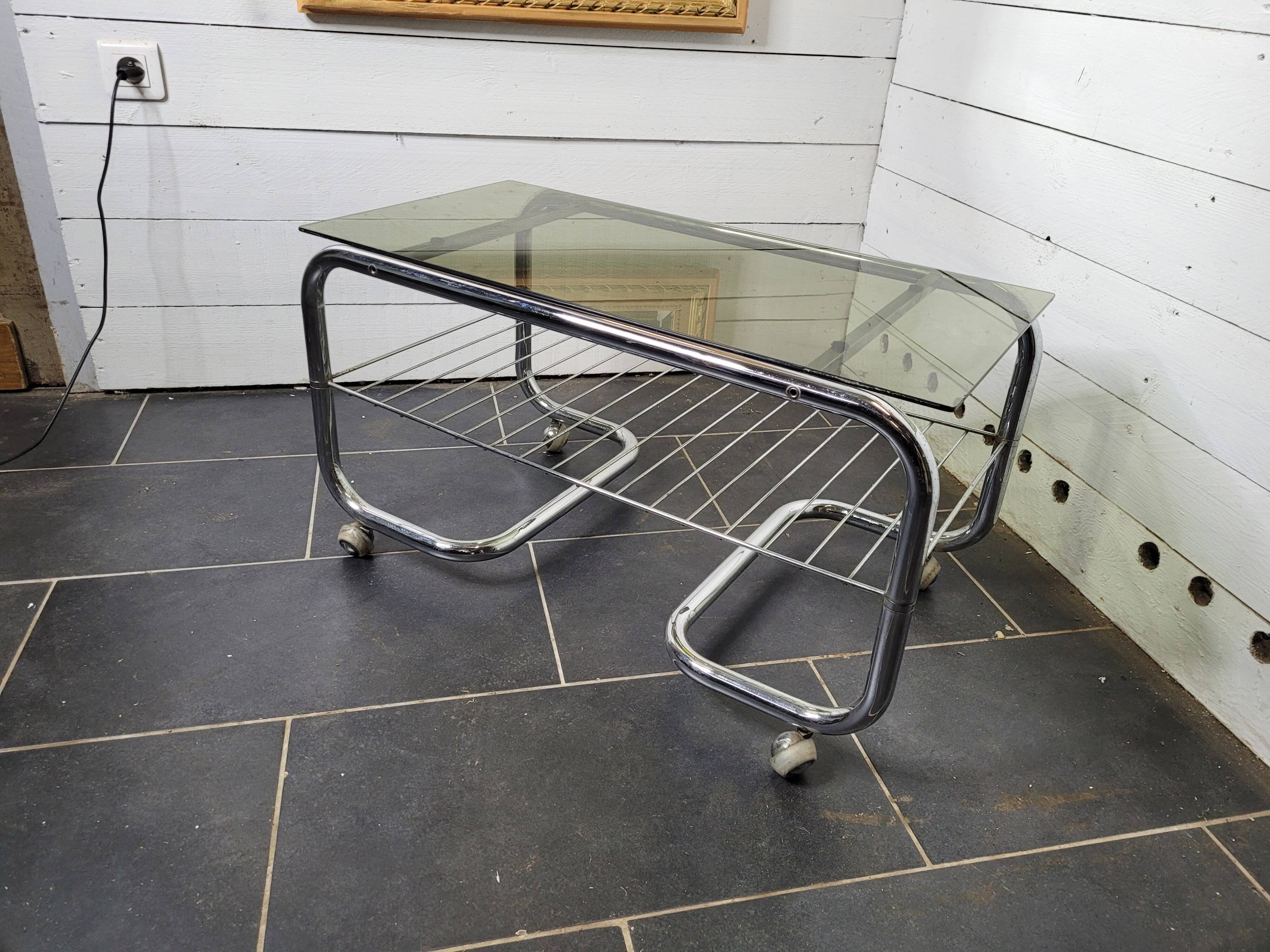 Coffee table with chrome base and smoked glass from the 70s