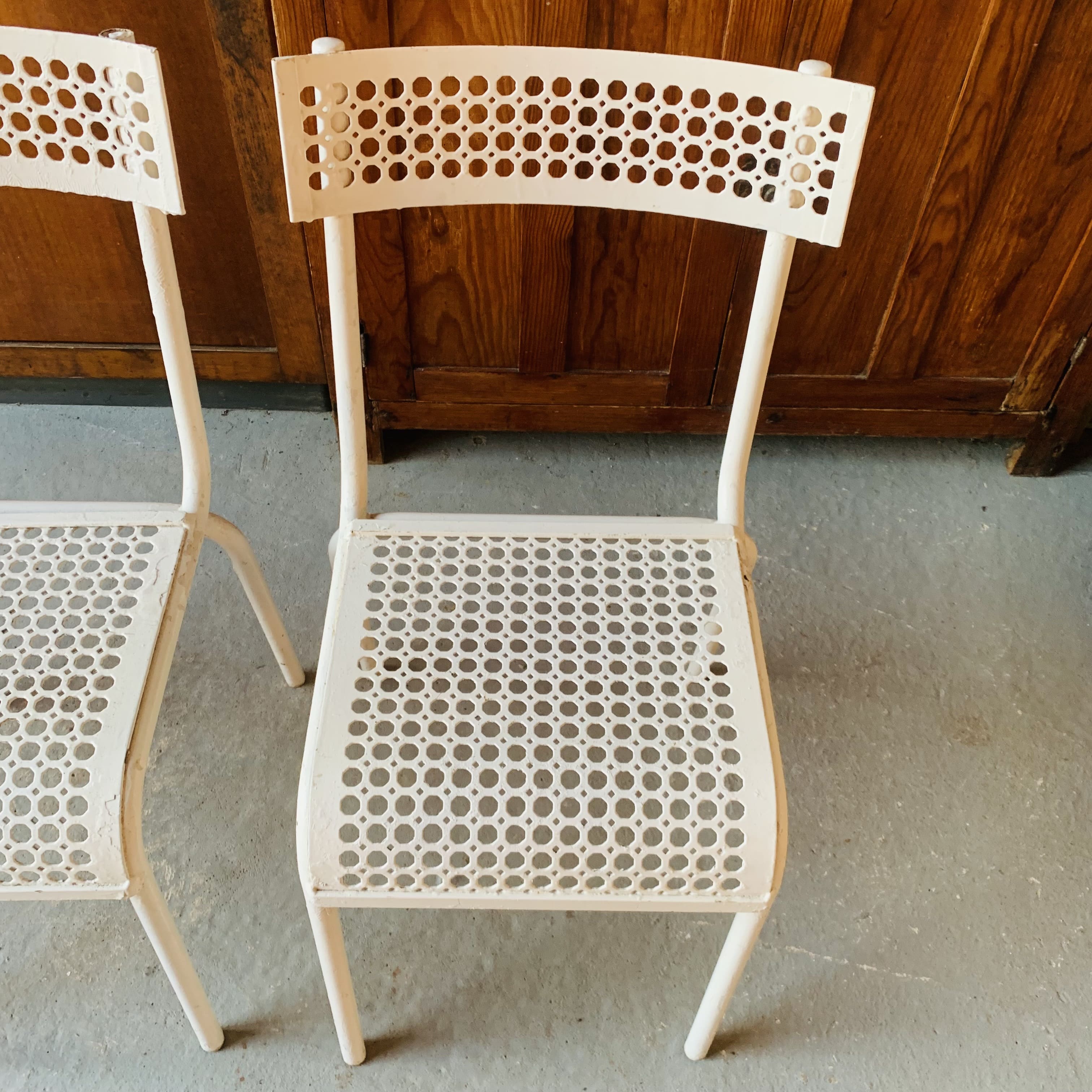 Series of 3 perforated metal chairs