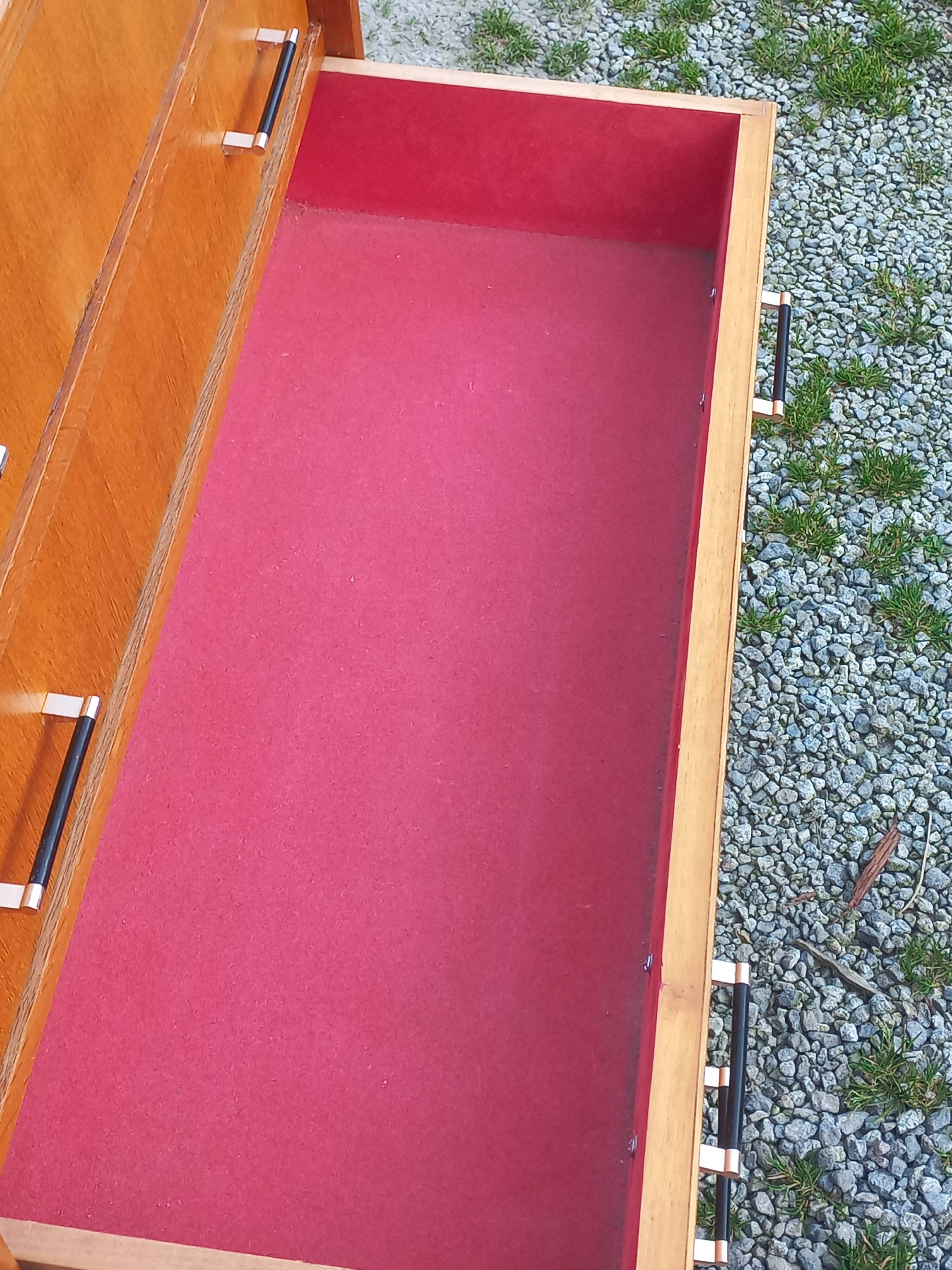 Vintage oak commode with tapered legs and wings from the 1950s.
