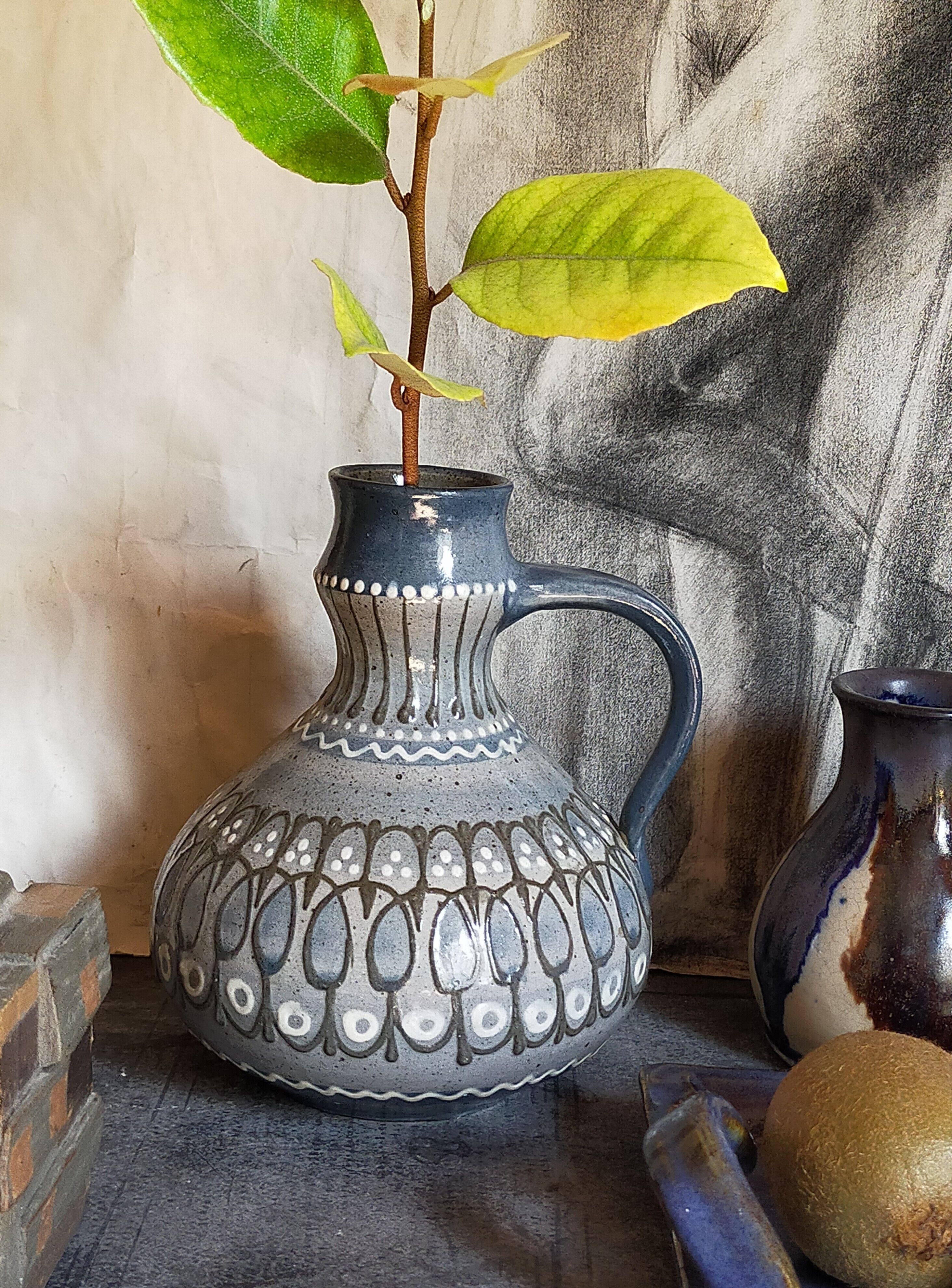 Ceramic handle vase with vintage graphic decoration