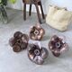 Four wooden flower wall lights from the 1970s.
