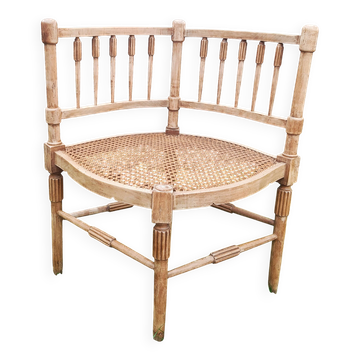 Corner chair in beech, caned seat from the early 20th century.
