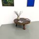 Brutalist coffee table in solid teak, monolithic slab, tripod base.