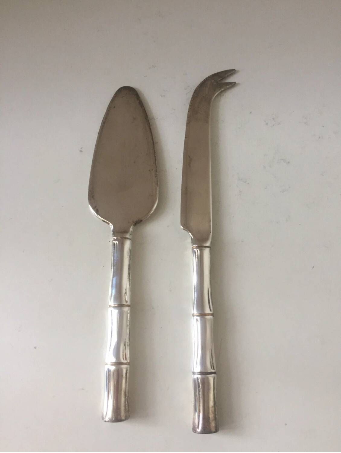 Silver-plated metal cheese serving cutlery and bamboo