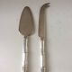 Silver-plated metal cheese serving cutlery and bamboo