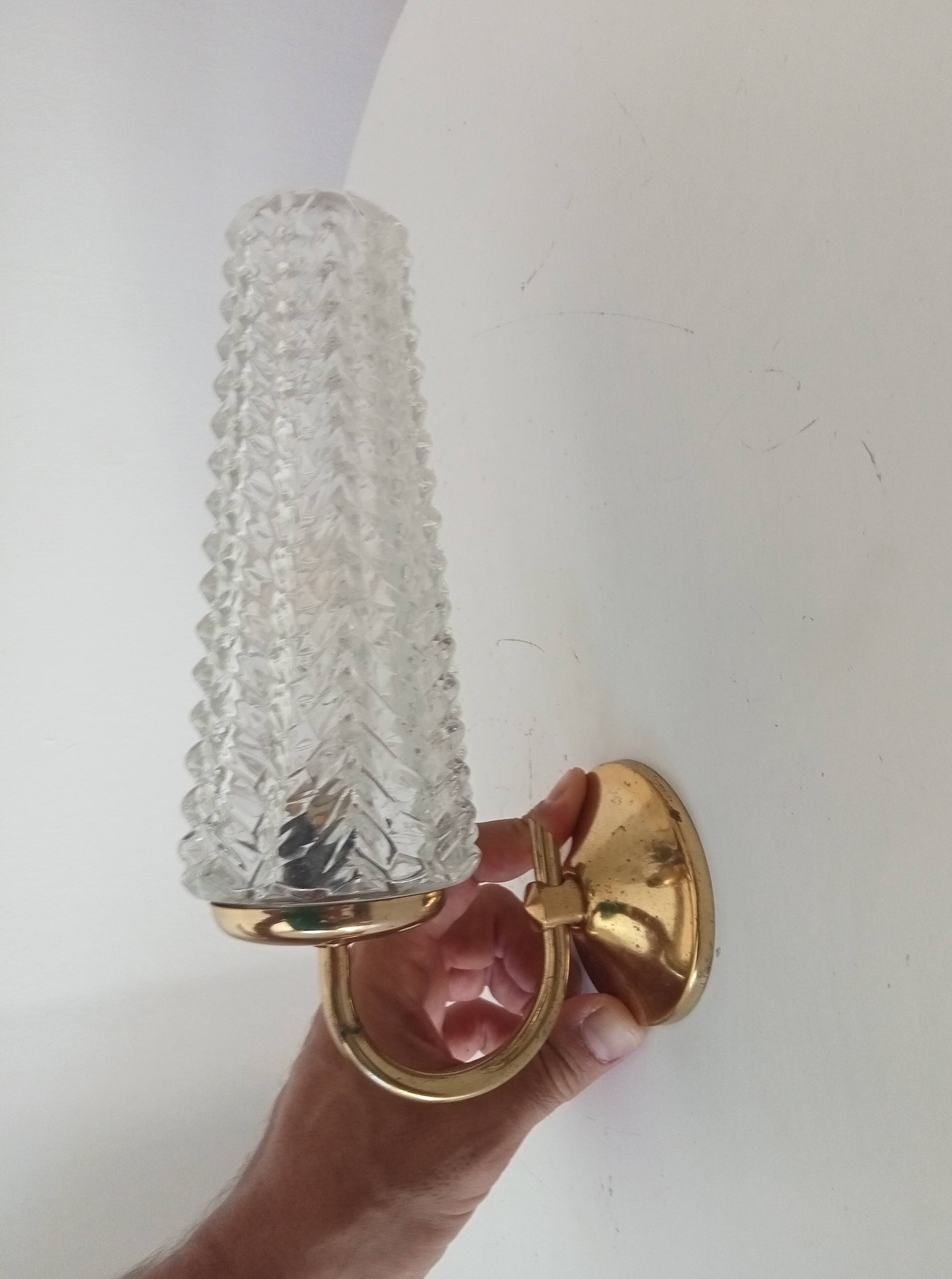 Vintage wall light in brass and etched glass.