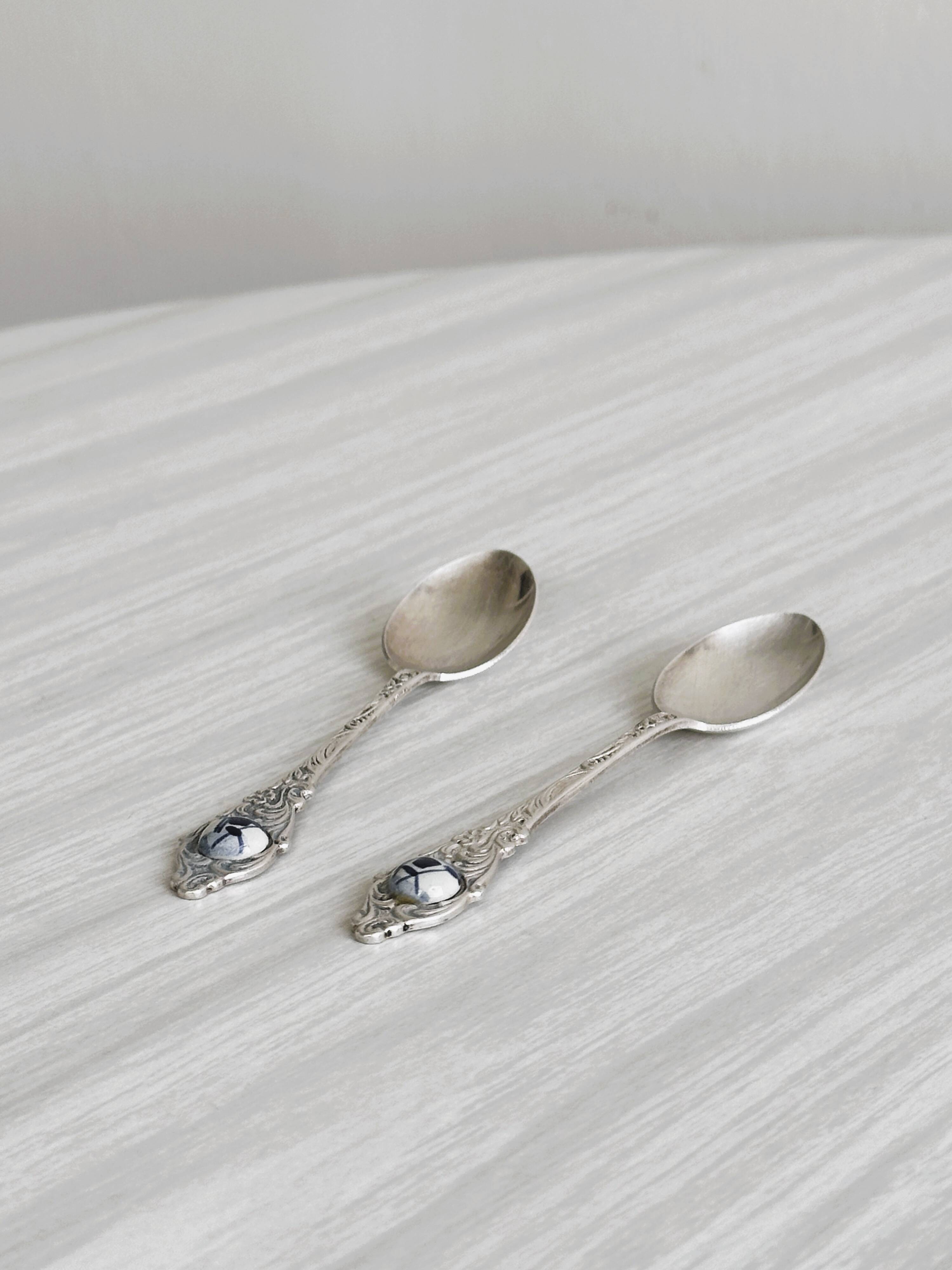 Two small metal spoons