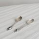 Two small metal spoons