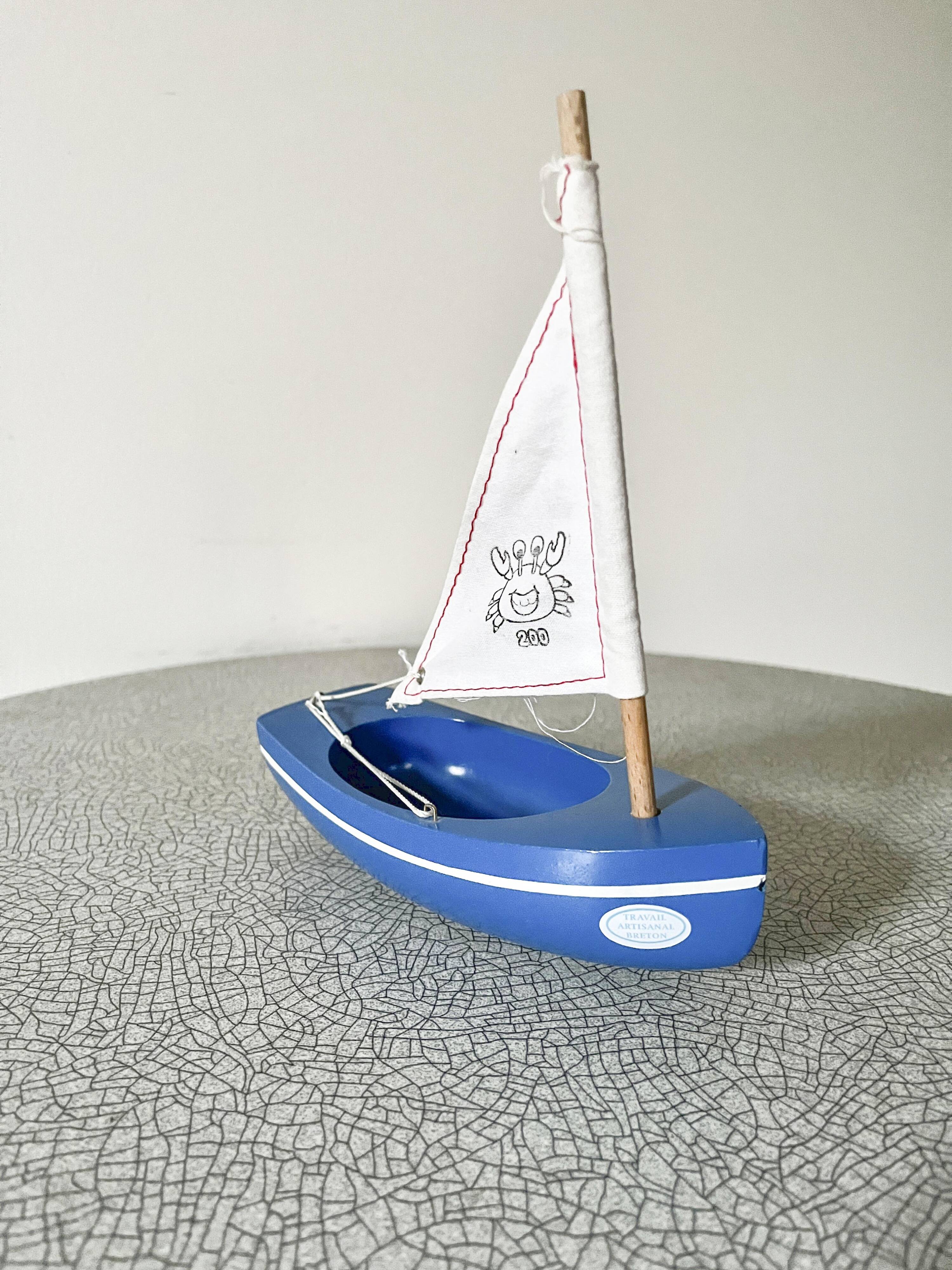 Blue basin sailboat from the French brand Tirot 200, vintage toy.