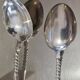 12 small Christofle Marly silver-plated spoons in the mascaron pattern.