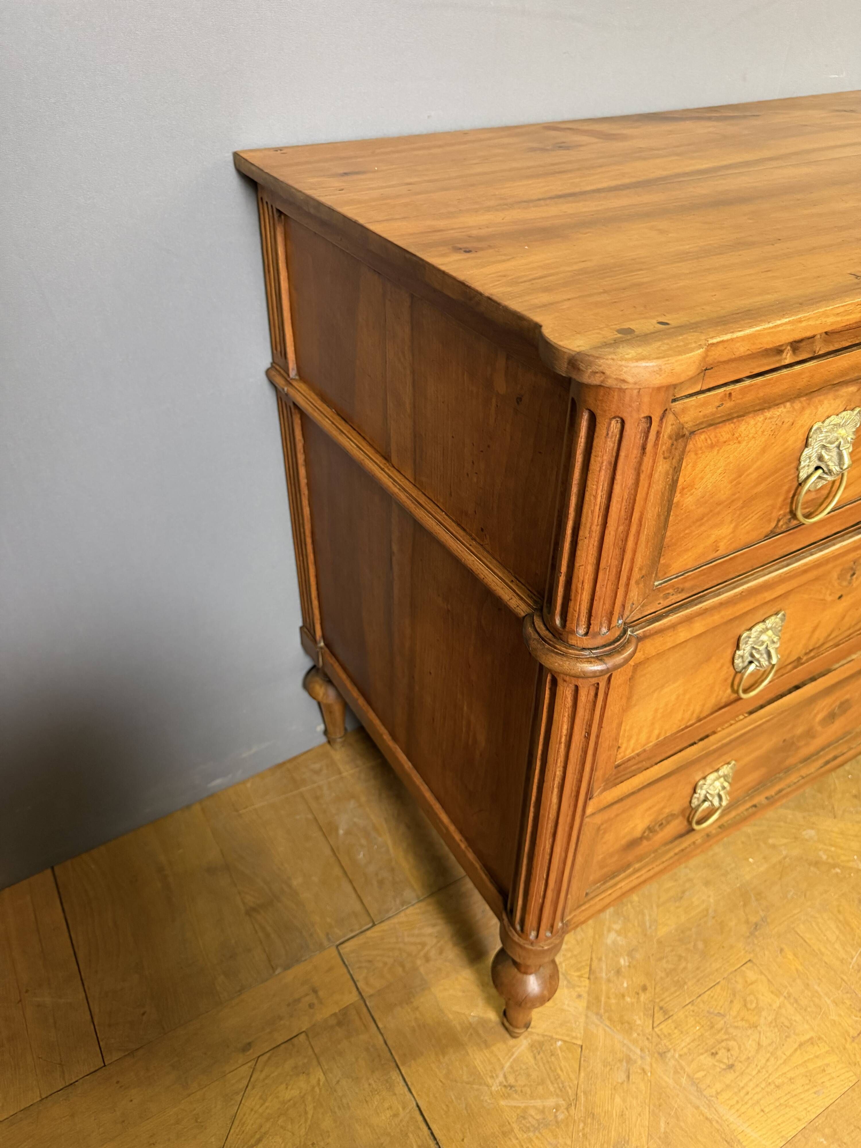 Louis XVI period commode in light walnut.