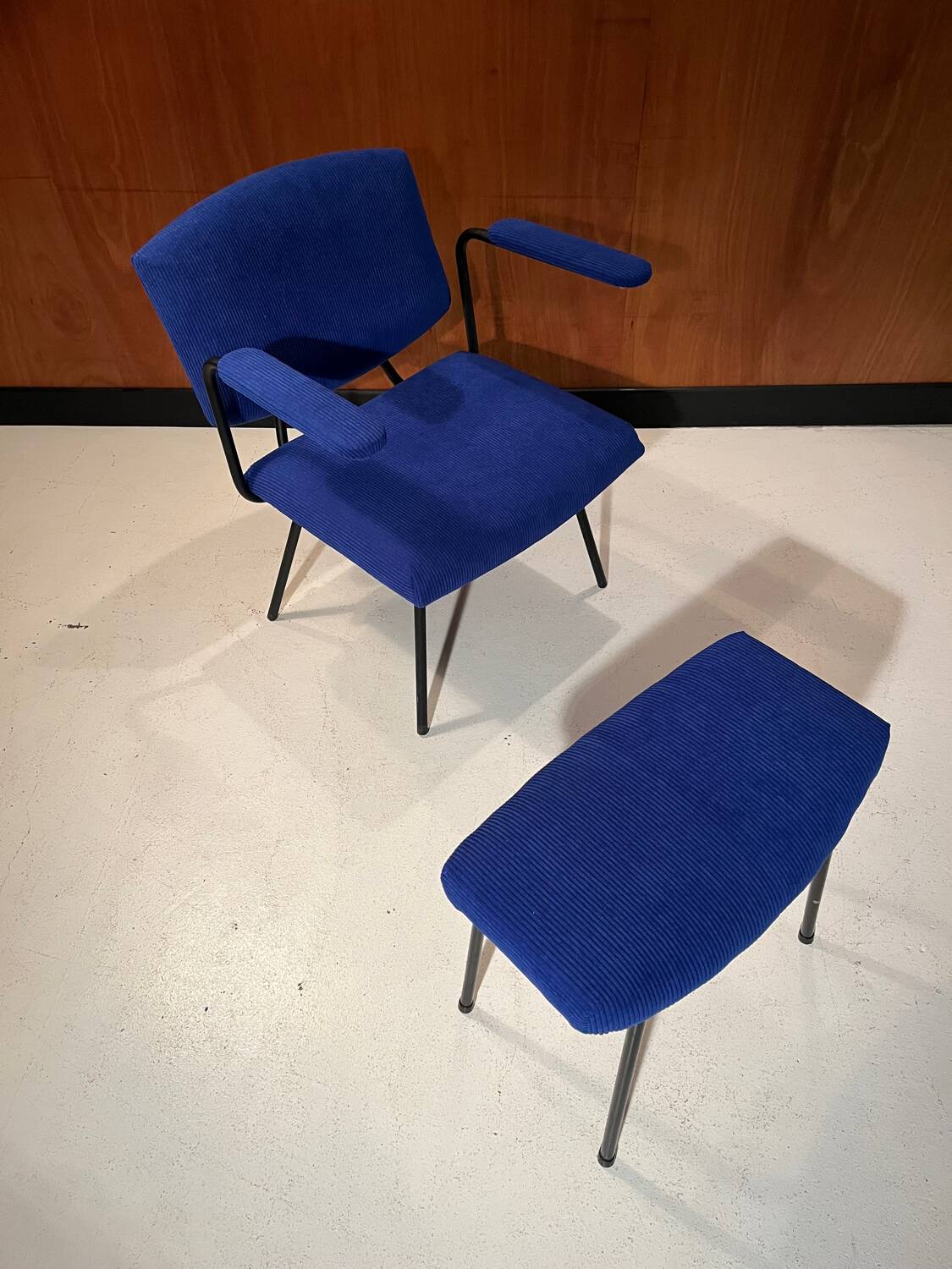 Vintage armchair and its footrest from around 1950.