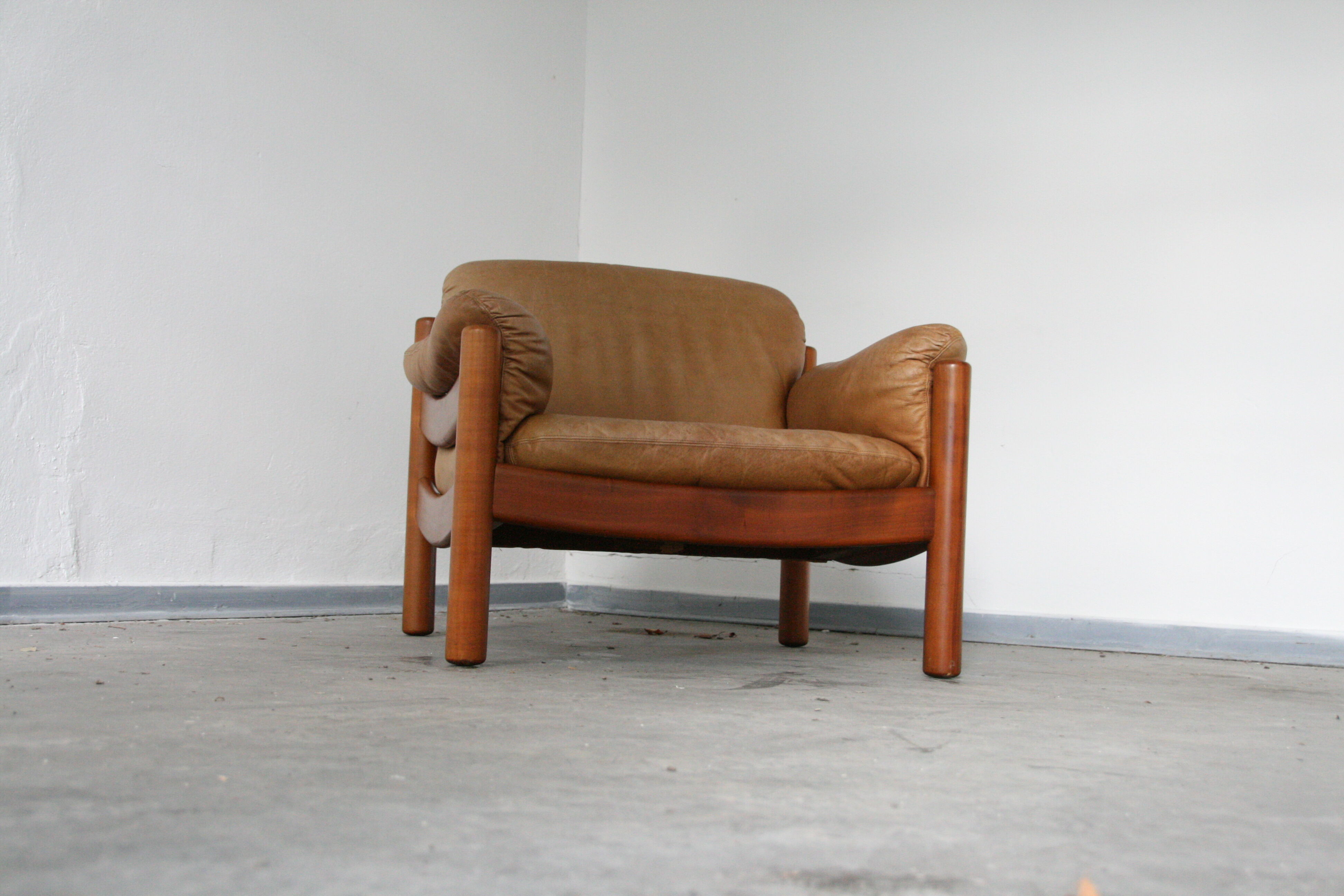 Teak and leather club armchairs