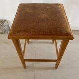 Vintage stool from the 60s with aged leather seat