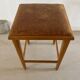 Vintage stool from the 60s with aged leather seat