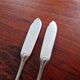 Christofle - Set of 2 fish knives, Rubans croisés model, in silver-plated metal