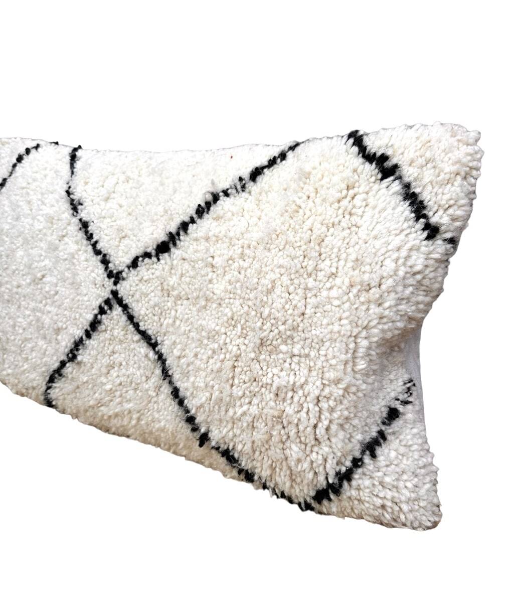 Bohemian wool pillow cover on a Beni Ourain Berber cushion. The cushion cover