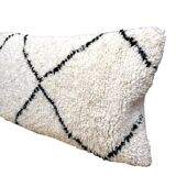 Bohemian wool pillow cover on a Beni Ourain Berber cushion. The cushion cover