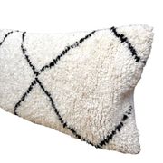 Bohemian wool pillow cover on a Beni Ourain Berber cushion. The cushion cover