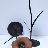 Pair of flower-shaped candlesticks in black metal and copper