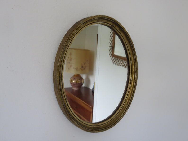 Old oval mirror in gilded wood 50s 60s
