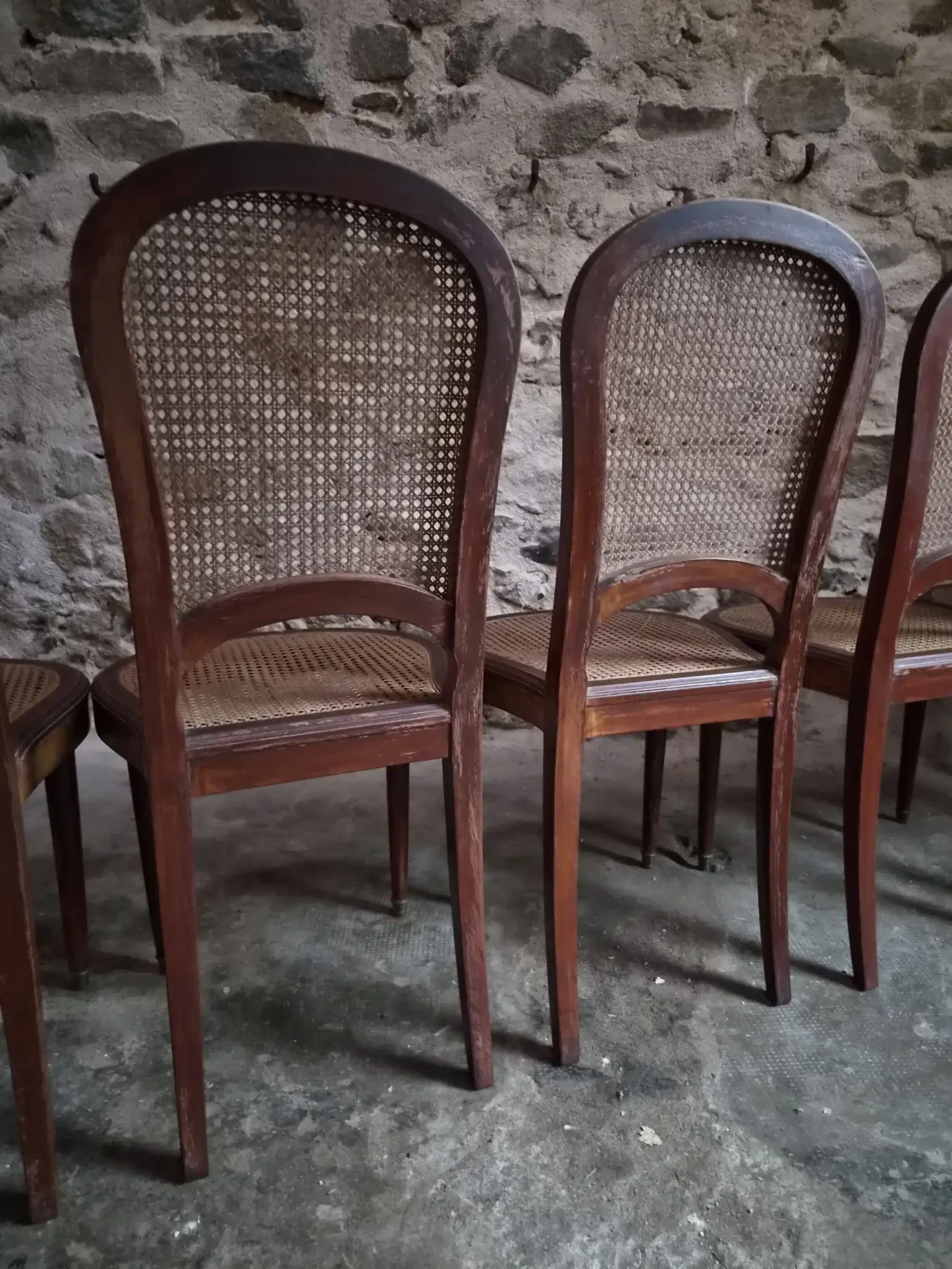 Set of 6 antique Louis XVI style dining chairs with caning.