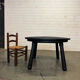 Brutalist round table in burnt wood yakisugi