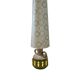 Vintage ceramic floor lamp with illuminated base.