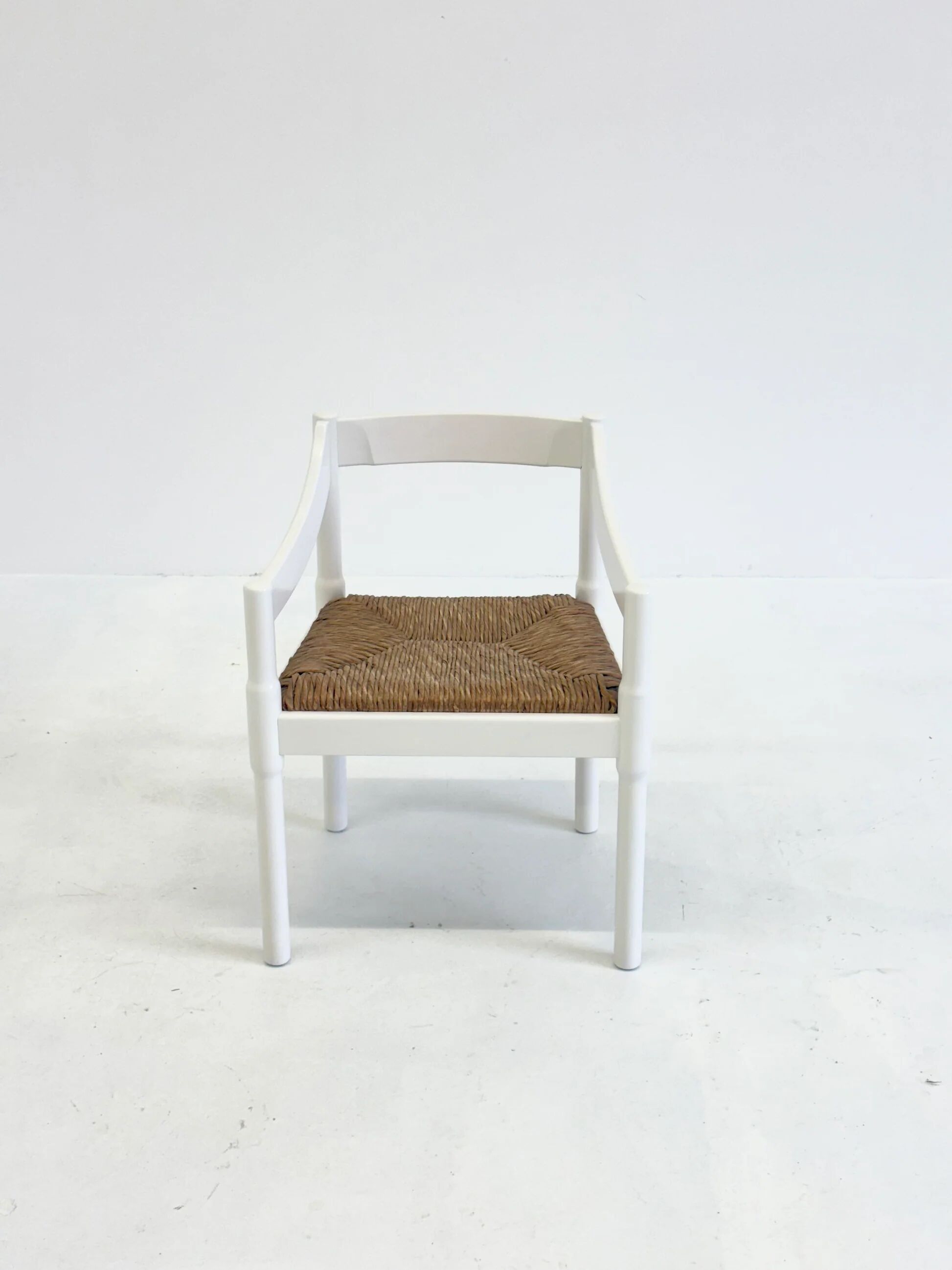 Set of two Carimate chairs by Vico Magistretti in white